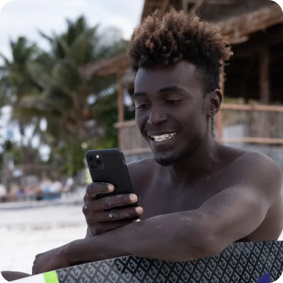 Person looking at his phone and smiling